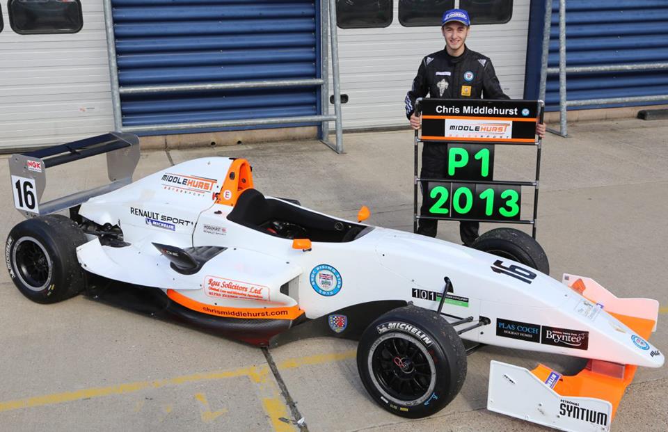 Chris Middlehurst stands by his Championship winning 2013 Protyre Formula Renault car with a P1pit board
